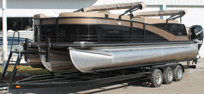Harris Grande Mariner pontoon boat on trailer